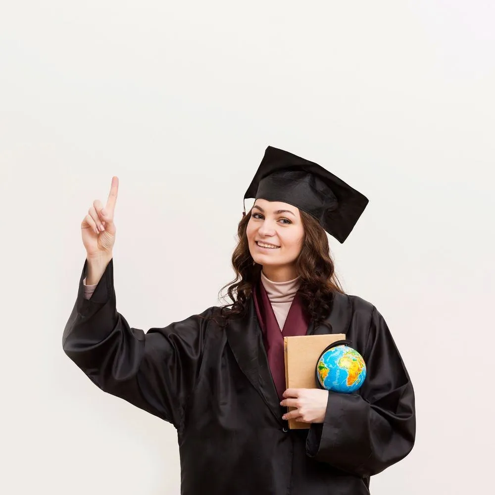 Graduate holding a globe and book